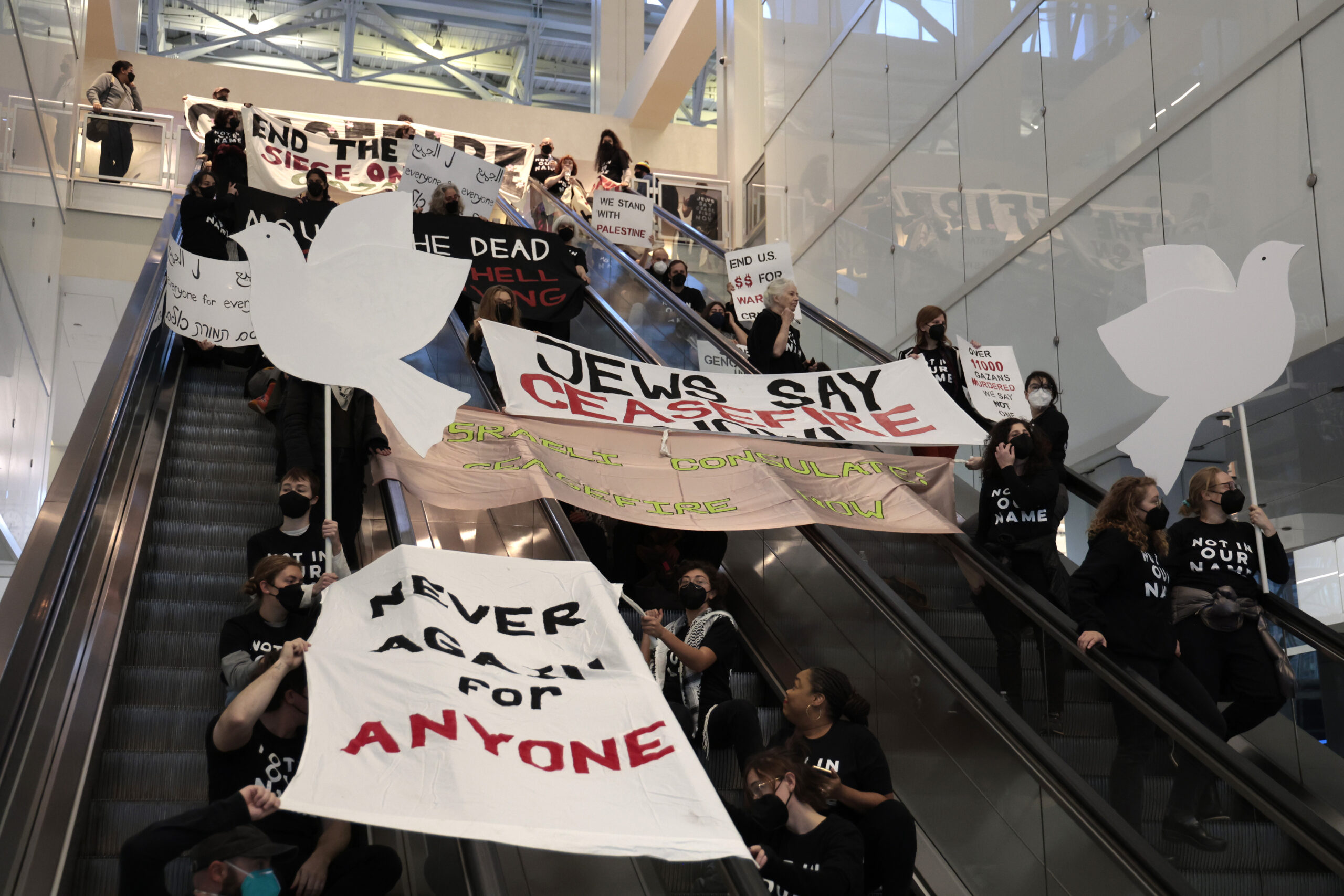 Israel war: Israel-Hamas ceasefire protesters block escalators at Chicago tower