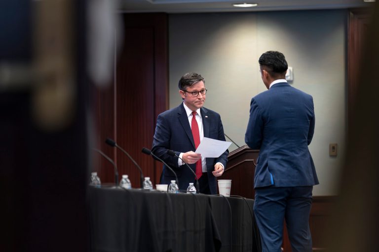 Speaker of the House Mike Johnson (R-LA) looks over his papers as he arrives early for a closed-door meeting with the Republican Conference at the Capitol in Washington, Tuesday, Nov. 14, 2023. 