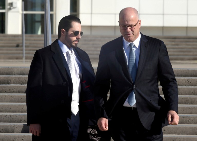 Samuel Miele, left, leaves Federal Court in Central Islip, New YYork, with his lawyer, Kevin Marino.