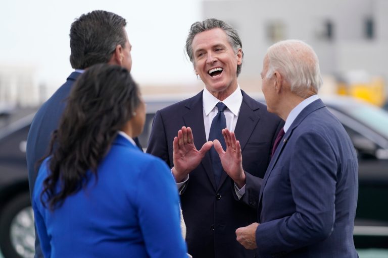 President Joe Biden talks with Gov. Gavin Newsom (D-CA) and his wife, Jennifer, San Francisco Mayor London Breed, and Rep. Kevin Mullin (D-CA) as he arrives at San Francisco International Airport for the APEC summit, Tuesday, Nov. 14, 2023.