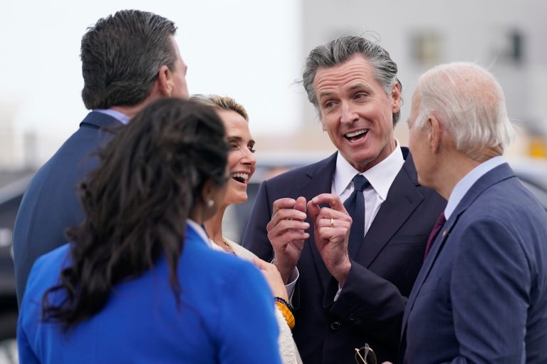 President Joe Biden (right) talks with Gov. Gavin Newsom (D-CA) (center) and his wife Jennifer, San Francisco Mayor London Breed, and Rep. Kevin Mullin (D-CA), as he arrives at San Francisco International Airport for the APEC summit on Tuesday, Nov. 14, 2023.