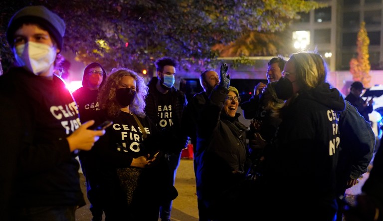 Protesters cheer outside the Democratic National Committee headquarters Wednesday, Nov. 15, 2023, in Washington.