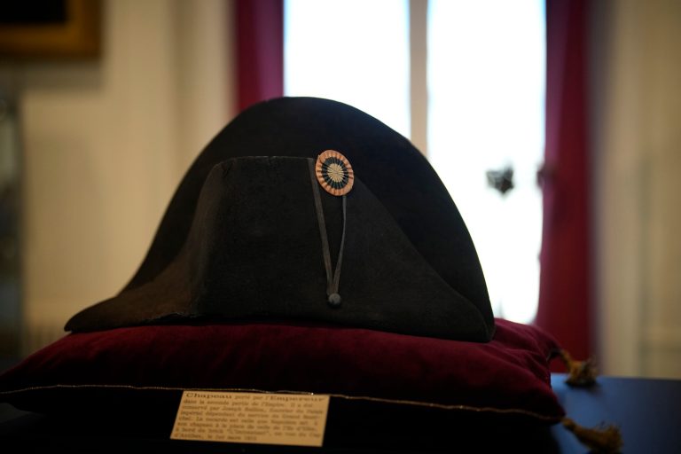 One of the signature broad, black hats that NapolÃ©on wore when he ruled 19th century France and waged war in Europe is on display at Osenat's auction house in Fontainebleau, south of Paris, Friday, Nov. 17, 2023. The hat is tipped to fetch more than half a million euros (dollars) at the auction Sunday of Napoleonic memorabilia patiently collected by a French industrialist. 