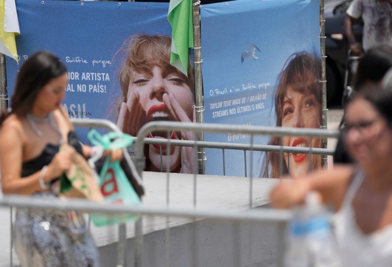 Taylor Swift fans wait for the doors of Nilton Santos Olympic stadium to open for her Eras Tour concert amid a heat wave in Rio de Janeiro, Brazil, Saturday, Nov. 18, 2023.