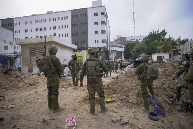 FILE - Israeli soldiers stand outside Shifa Hospital in Gaza City, Wednesday, Nov. 22, 2023. Ayah al-Wakeel, a lawyer, initially sought shelter at the hospital with her family but fled after an Israeli warning to leave. They returned to the hospital on Nov. 4 but she later texted that she felt unsafe and was going south. Israeli forces breached the hospital on Nov. 13. Al-Wakeel has not been heard from since.