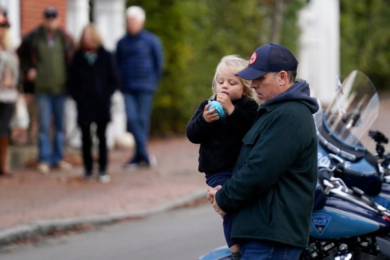 Hunter Biden carries his son Beau Biden as he visits local shops with his father President Joe Biden and other family members in Nantucket, Massachusetts, Saturday, Nov. 25, 2023.