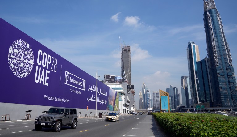 Cars pass by a billboard advertising COP28 at Sheikh Zayed highway in Dubai, United Arab Emirates, Monday, Nov. 27, 2023. Representatives will gather at Expo City in Dubai, UAE, Nov. 30 to Dec. 12 for the 28th U.N. Climate Change Conference, known as COP28.
