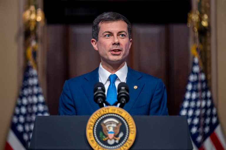 Transportation Secretary Pete Buttigieg, accompanied by President Joe Biden, speaks about supply chain issues in the Indian Treaty Room on the White House complex in Washington, Monday, Nov. 27, 2023.