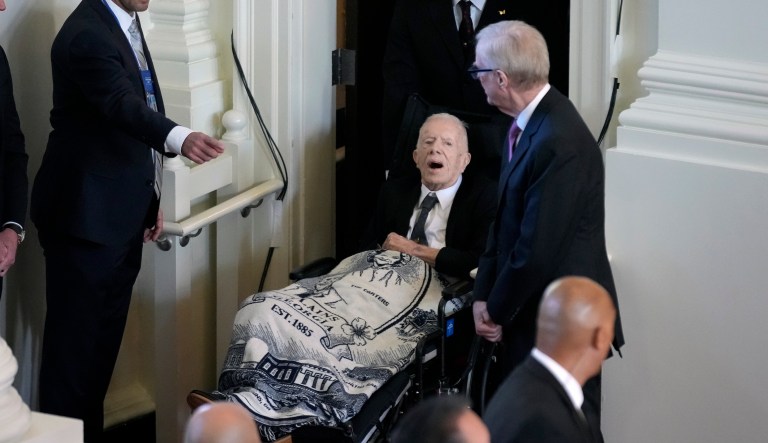 Former President Jimmy Carter arrives to attend a tribute service for his wife, Rosalynn Carter, at Glenn Memorial Church, on Tuesday, Nov. 28, 2023, in Atlanta.