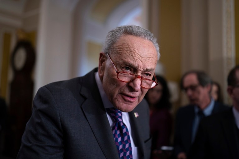 Senate Majority Leader Chuck Schumer (D-NY) answers questions from reporters outside the Senate chamber, at the Capitol in Washington, Tuesday, Nov. 28, 2023.