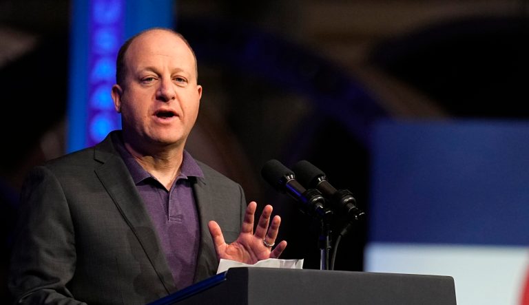 Jared Polis slammed for cringe-filled ‘Feliz Navidad’ performance amid immigrant crisis