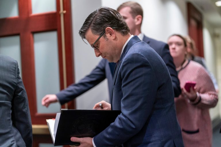 Speaker of the House Mike Johnson (R-LA) arrives to meet with fellow Republicans before the House of Representatives decides whether to expel Rep. George Santos (R-NY) from Congress on Friday, Dec. 1, 2023, at the Capitol in Washington.