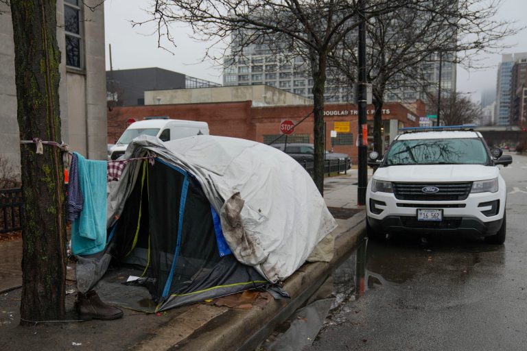One of several tents for migrants outside of the Chicago Police Department 1st district station Friday, Dec. 1, 2023, in Chicago. Officers at the station said they were unaware of when the remaining migrants might be moved from the station. (AP Photo/Erin Hooley)