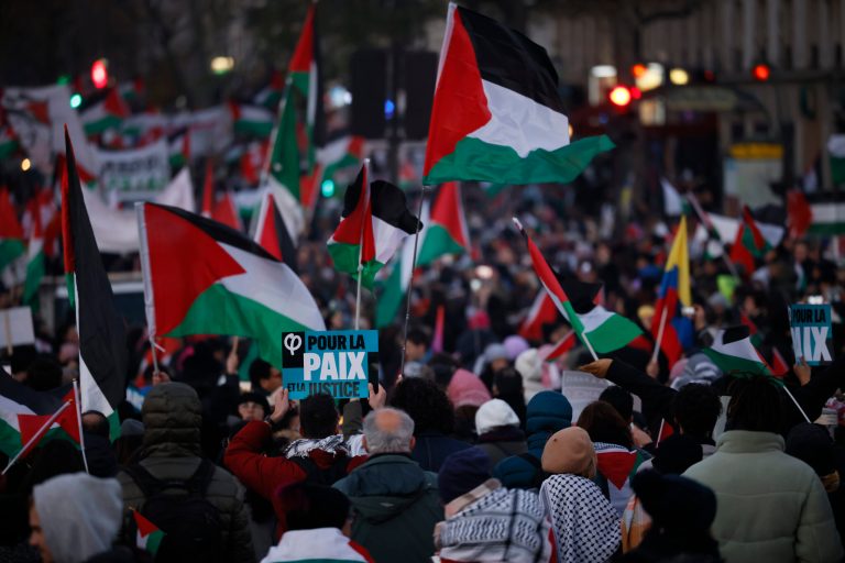 Demonstrators march during a pro-Palestinian rally in Paris, Saturday, Dec. 2, 2023. Israel is pounding targets in the southern Gaza Strip, intensifying a renewed offensive after a weeklong truce with Hamas and giving rise to renewed concerns about civilian casualties.