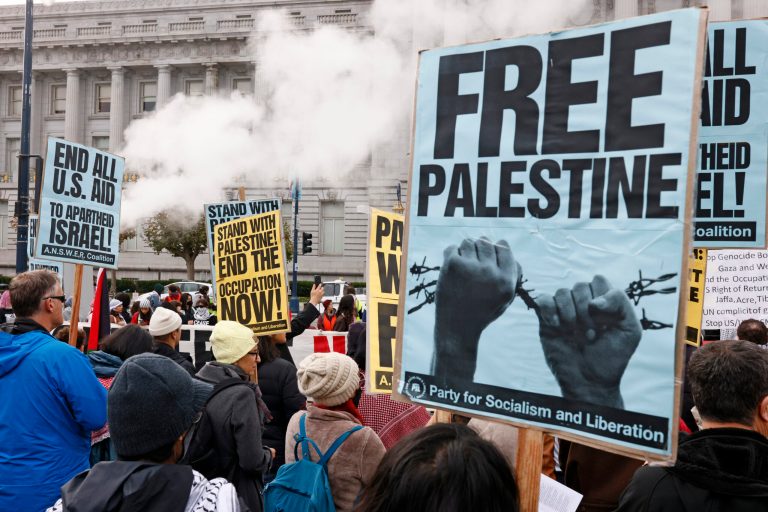 Palestinian supporters rally and protest outside San Francisco City Hall, Saturday, Dec. 2, 2023. 