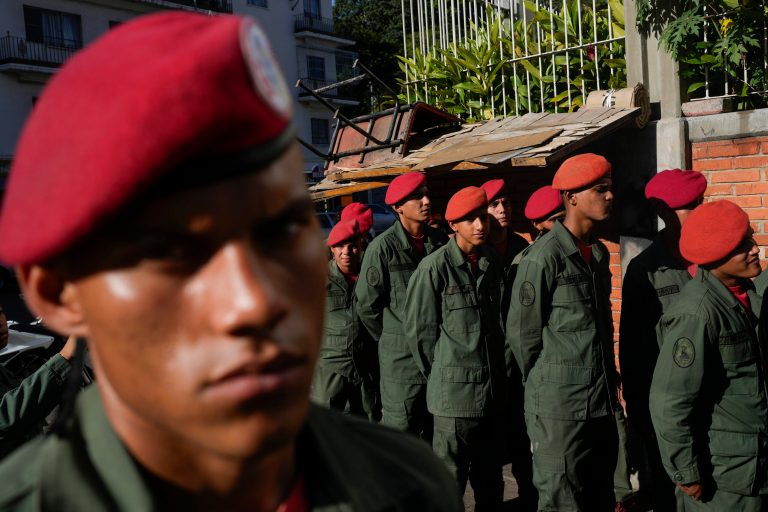 Members of the Presidential Guard line up in Caracas ahead of referendum on the future of a disputed territory with Guyana. The country voted to clam Guyana as sovereign territory, sparking fears of annexation. (AP/Matias Delacroix)