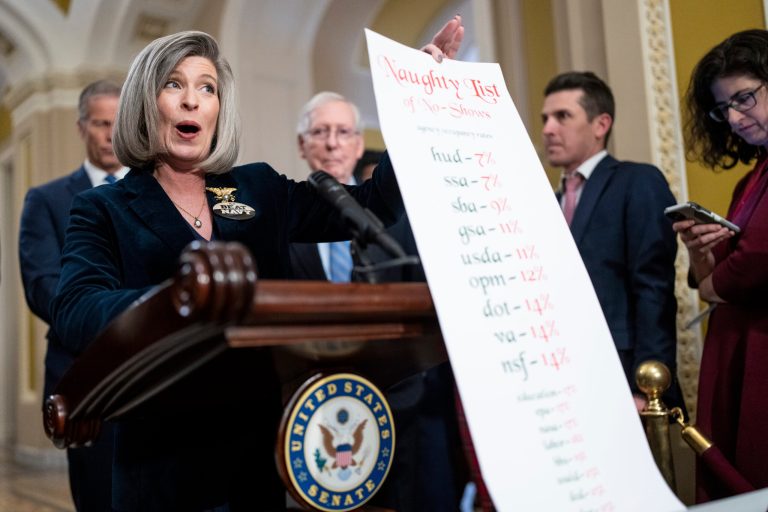 Sen. Joni Ernst (R-IA) unfurls her 