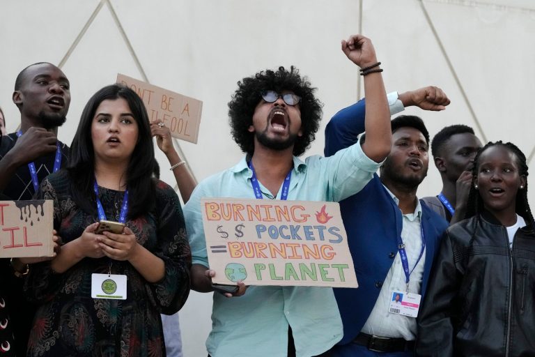 Activists participate in a demonstration at the COP28 U.N. Climate Summit on Friday, Dec. 8, 2023, in Dubai, United Arab Emirates.