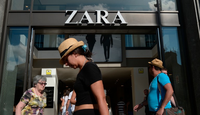 People walk past a Zara store in Barcelona, Spain, Aug. 27, 2014. The Spanish fashion brand Zara has pulled advertising images that to some appeared to reference Israelâs war against Hamas in Gaza.