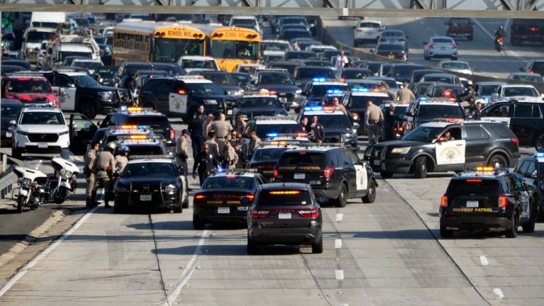 Police state on the 110 freeway after pro-Palestinian protesters blocked in during the morning commute Wednesday, Dec. 13, 2023, in Los Angeles.
