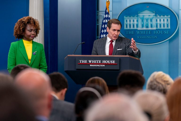 National Security Council spokesman John Kirby, right, accompanied by White House press secretary Karine Jean-Pierre, left, speaks at a press briefing at the White House in Washington, Thursday, Dec. 14, 2023.