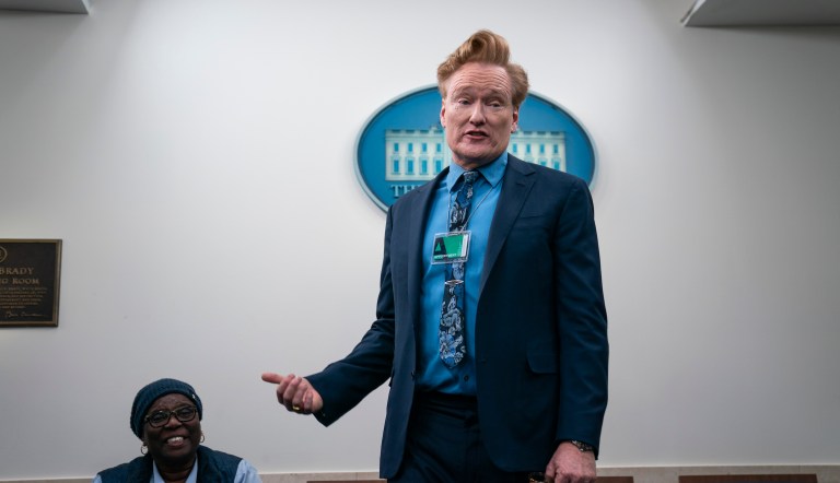 Comedian Conan O'Brien talks with journalists on Friday, Dec. 15, 2023, as he visits the White House briefing room in Washington.