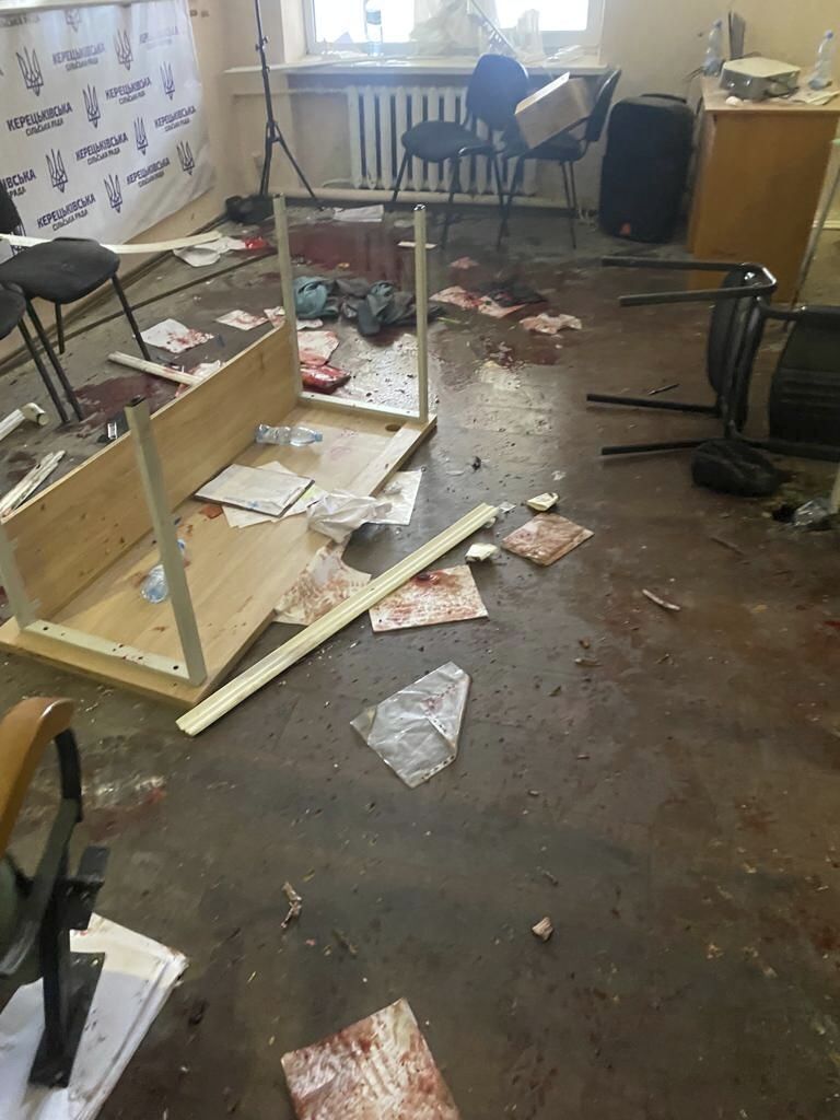 In this photo provided by the Ukrainian Police Press Office, blood is seen at the scene of an incident with exploded grenades in Keretske, Zakarpattia region, Ukraine, on Friday, Dec. 15, 2023. A village council member in western Ukraine detonated three hand grenades during a meeting Friday, critically injuring himself and at least two dozen other people, authorities said.