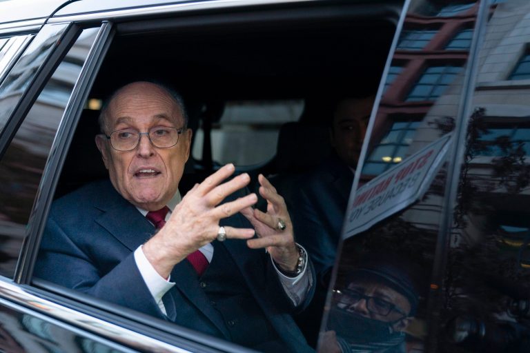Former Mayor of New York Rudy Giuliani talks to reporters as he leaves after his defamation trial in Washington, Friday, Dec. 15, 2023. A jury awarded $148 million in damages on Friday to two former Georgia election workers who sued Giuliani for defamation over lies he spread about them in 2020 that upended their lives with racist threats and harassment. 