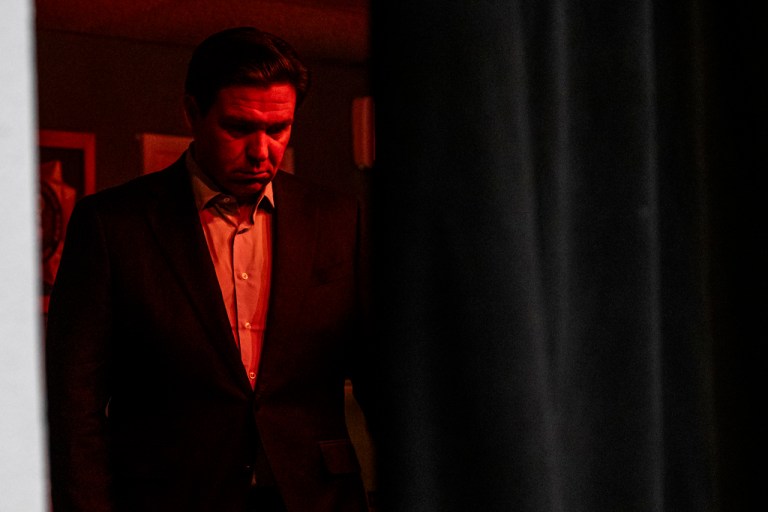 Gov. Ron DeSantis (R-FL) waits backstage during a meet and greet event at VFW Post 788 in Cedar Rapids, Iowa, on Tuesday, Dec. 19, 2023. 