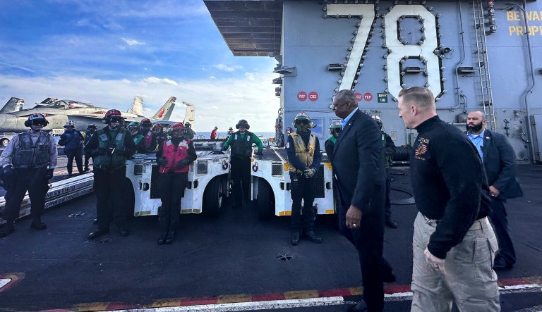 Austin visits troops on Gerald Ford, ‘linchpin of preventing a wider regional conflict’