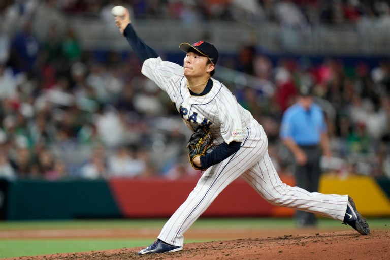 FILE - Japan's Yoshinobu Yamamoto delivers a pitch during the fifth inning of a World Baseball Classic game against Mexico on March 20, 2023, in Miami. 