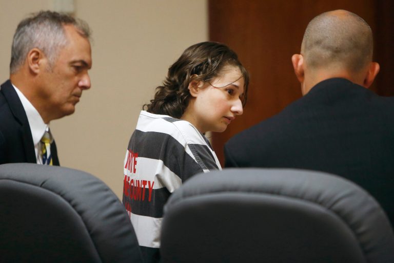 FILE - Gypsy Rose Blanchard speaks with her attorney's Mike Stanfield, right, and Clate Baker before her court appearance, July 5, 2016, in Springfield, Mo. Blanchard, the Missouri woman who admitted to convincing her online boyfriend to kill her abusive mother after being forced to pretend for years she was suffering from leukemia, muscular dystrophy and other serious illnesses, was paroled Thursday, Dec. 28, 2023. (Andrew Jansen/The Springfield News-Leader via AP, File)