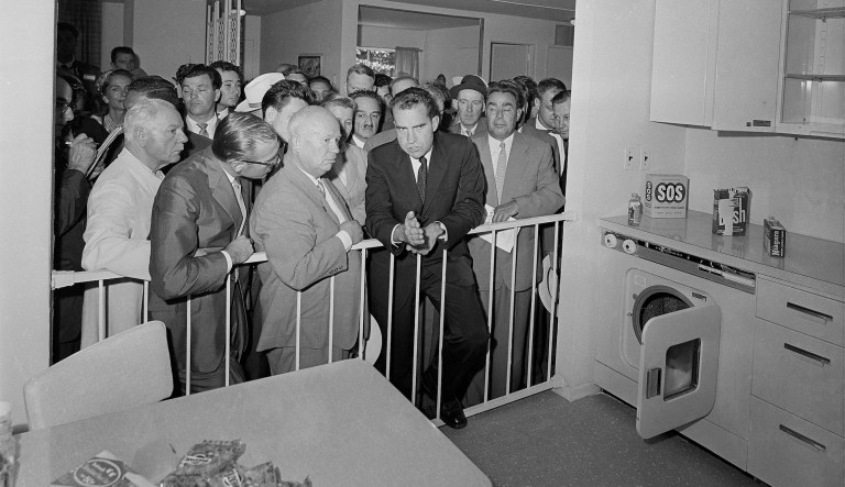 U.S. Vice President Richard Nicon, center, and Soviet Premier Nikita Khrushchev, left center, are engaged in a discussion as they stand in front of a kitchen display at the United States exhibit at Moscow's Sokolniki Park, July 24, 1959. While touring the exhibit, both men kept a running debate on the merits of their respective countries. Standing on the right is Khrushchev's deputy, Leonid Brezhnev.