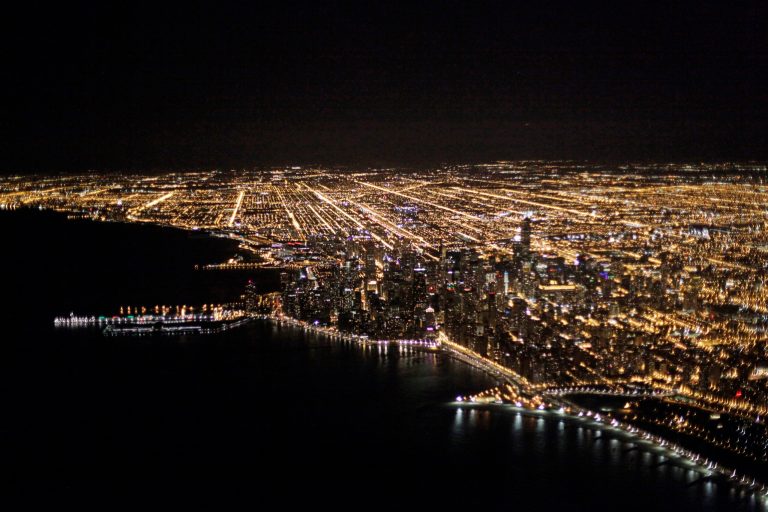 An aerial view at night of the downtown Chicago skyline is seen Sunday, Nov. 24, 2013. (AP Photo/Kiichiro Sato)