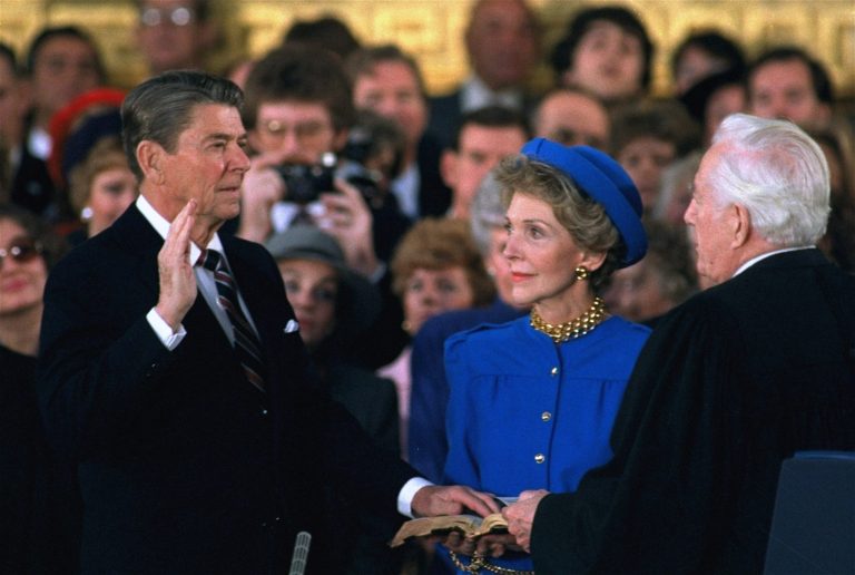 First Lady Nancy Reagan watches as President Ronald Reagan is sworn in during ceremonies in the Rotunda beneath the Capitol Dome in Washington on Jan. 21, 1985. Reagan, forced indoors by a record inaugural freeze, reenacted his oath taking and sounded a second term dedication to his conservative principles.