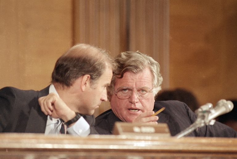 Sen. Edward Kennedy (D-Mass.), right, and Sen. Joseph Biden (D-Del.), confer during the confirmation hearings for Chief Justice nominee William Rehnquist, before the Senate Judiciary Committee, July 30, 1986.  (AP Photo/Lana Harris)