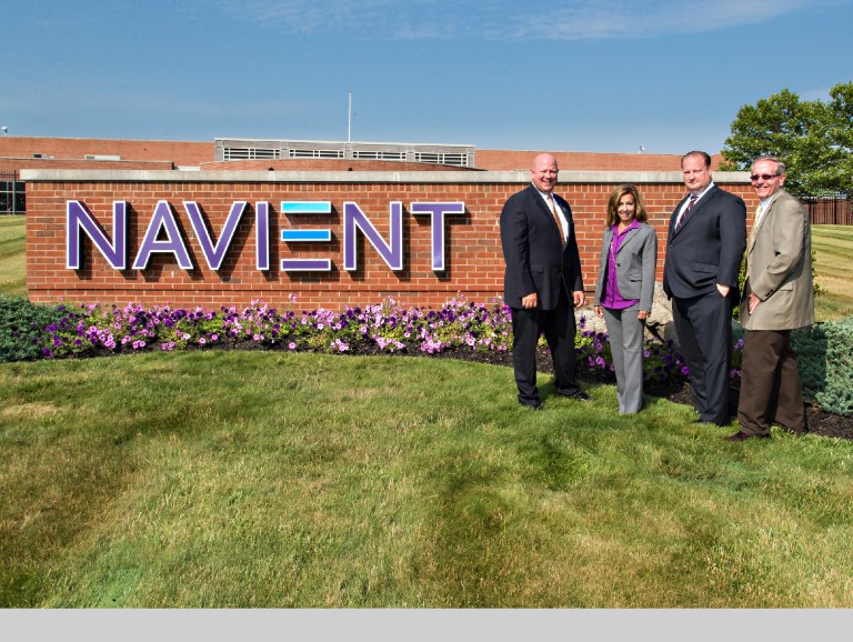 Local officials joined Navient leaders to unveil the company's new exterior sign. 