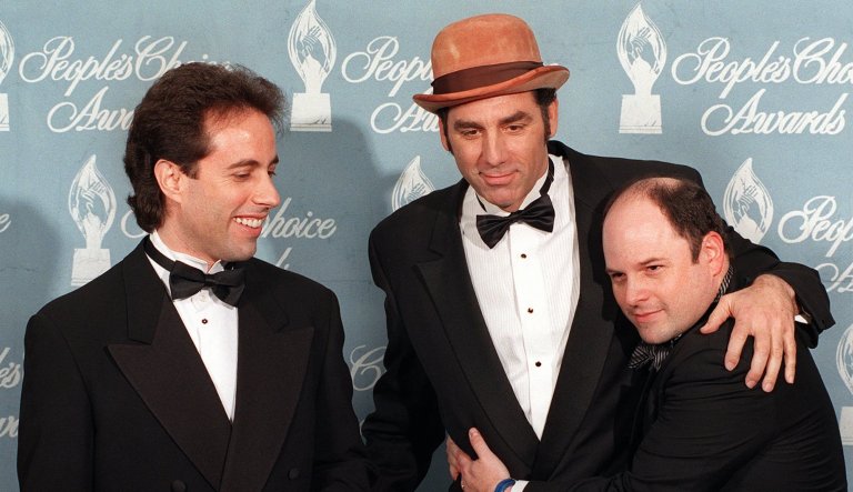 Jerry Seinfeld, left, poses with Michael Richards, center, and Jason Alexander after their show 