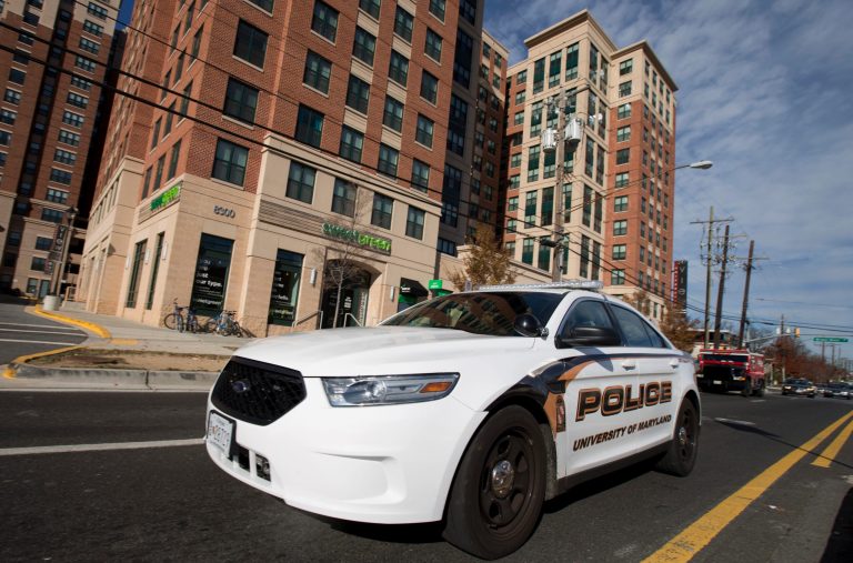 This photo taken Nov. 25, 2013 shows a University of Maryland Police Department vehicle patrolling Baltimore Avenue in College Park, Md. at the extended jurisdiction area of the University of Maryland. (AP Photo/Manuel Balce Ceneta)