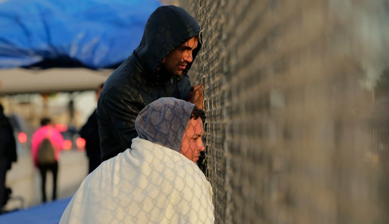 Yenly Herrera, front, and Yenly Morales, immigrants from Cuba seeking asylum in the United States, wait on the Brownsville and Matamoros International Bridge, Friday, Nov. 2, 2018, in Matamoros, Mexico.