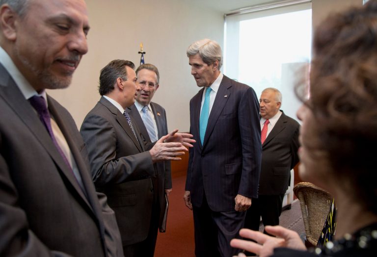 Secretary of State John Kerry talks with with Mexican Foreign Secretary Jose Antonio Meade, accompanied by US Ambassador to Mexico, E. Anthony Wayne, third from left, and Mexican Education Secretary Emilio Chuayffet, fifth from left, before they join a joint bilateral forum on higher education, innovation and research, at the Ministry of Foreign Affairs in Mexico City,  Wednesday, May 21, 2014. (AP Photo/Carolyn Kaster, Pool)