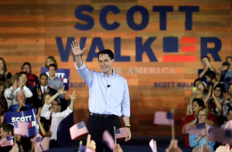 Wisconsin Gov. Scott Walker waves to supporters after announcing that he is running for the 2016 Republican presidential nomination at the Waukesha County Expo Center, Monday, July 13, 2015, in Waukesha, Wis. (AP Photo/Morry Gash)