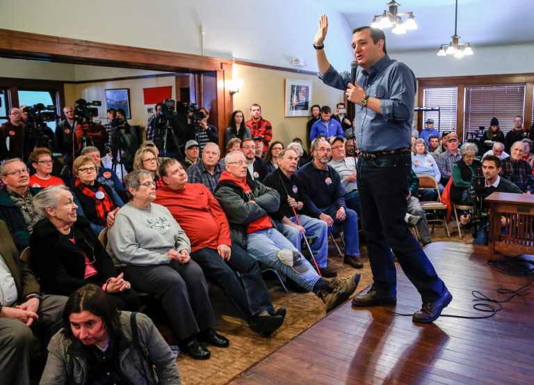As President Obama unveiled his new executive actions at the White House, Ted Cruz provided instant analysis on the campaign trail in Iowa. (AP Photo)
