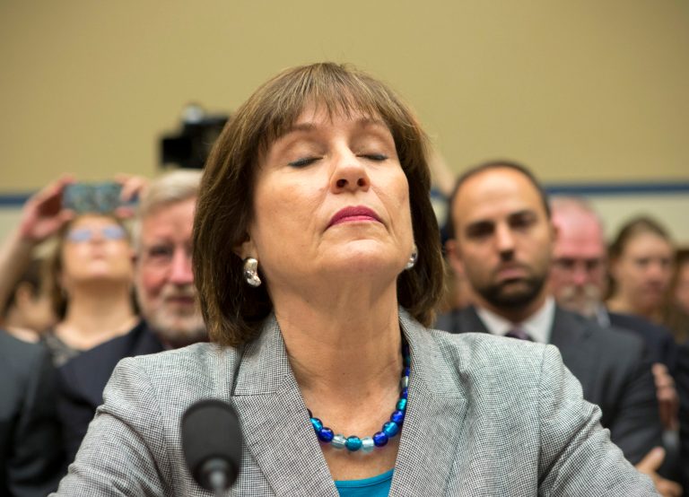 Lois Lerner, head of the IRS unit that decides whether to grant tax-exempt status to groups, listens on Capitol Hill in Washington, Wednesday, May 22, 2013, during a House Oversight and Government Reform Committee hearing to investigate the extra scrutiny the IRS gave to Tea Party and other conservative groups that applied for tax-exempt status. Lerner later invoked her constitutional right to not answer questions and was dismissed by House Oversight Committee Chairman Darrell Issa, R-Calif.    (AP Photo/J. Scott Applewhite)