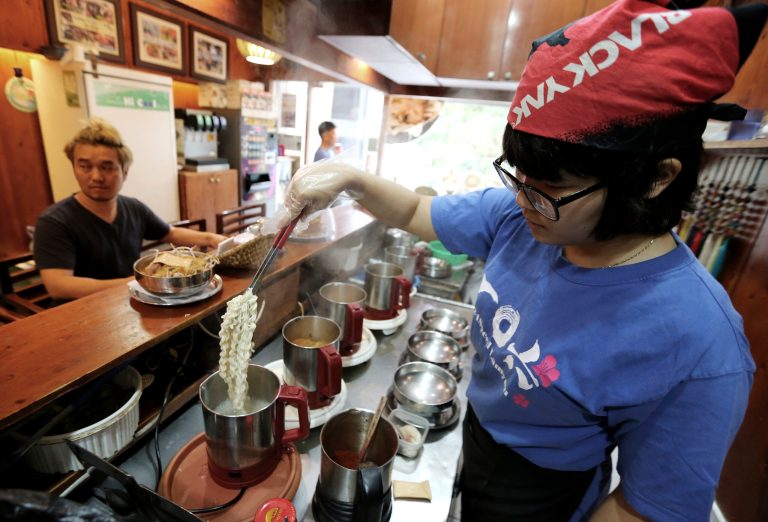 In this Aug. 19. 2014 photo, a cook prepares 