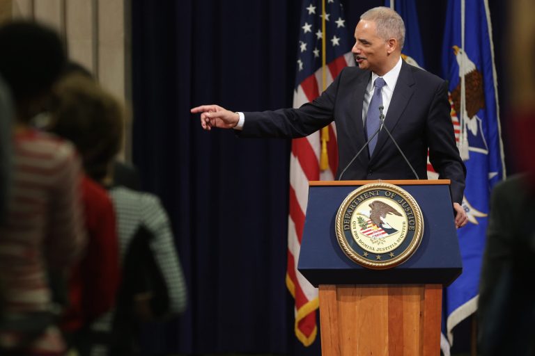U.S. Attorney General Eric Holder thanks Justice Department employees as he delivers his parting remarks at the Robert F. Kennedy building April 24, 2015 in Washington. (Photo by Chip Somodevilla/Getty Images)