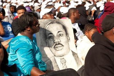 A poster displaying Dr. Martin Luther King Jr. at his dedication ceremony in Washington D.C., Sunday, Oct 16th, 2011