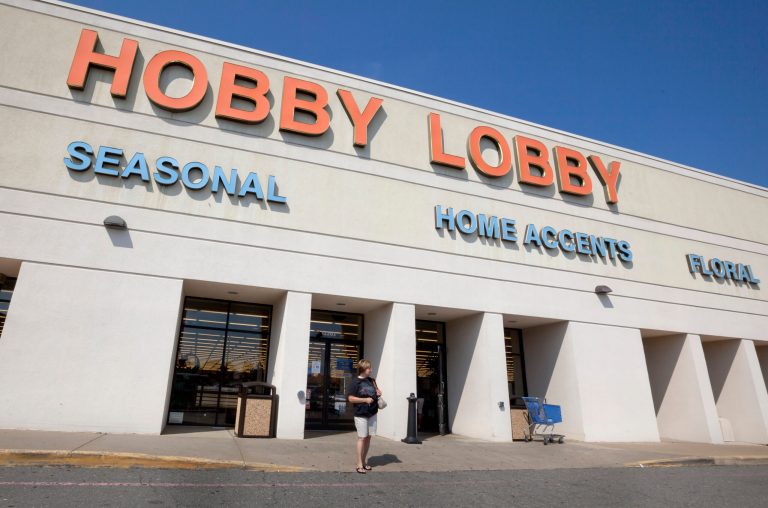 A woman walks from a Hobby Lobby Inc., store in Little Rock, Ark. Hobby Lobby Stores, the arts and craft supply chain that wants to block enforcement part of the new federal health care law that requires employers to cover insurance costs for the morning-after pill and the week-after pill is heading to court. (AP/Danny Johnston)