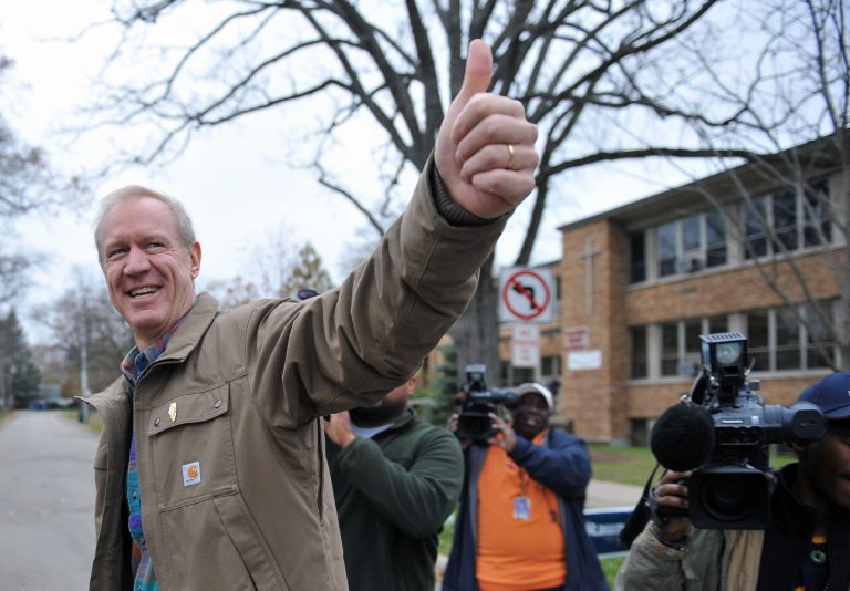 Republican gubernatorial candidate Bruce Rauner gives a thumbs up outside his polling place at Sacred Heart Center in Winnetka, Ill. on Election Day, Tuesday, Nov. 4, 2014. (AP Photo/Sun-Times Media, Al Podgorski)Â 
