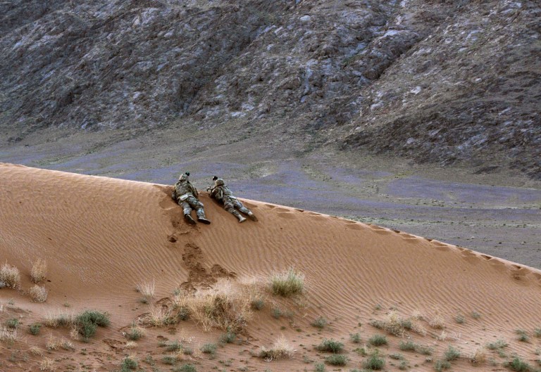 In this April 10, 2013 photo released by the U.S. Army, soldiers assigned to Charlie Company, 1st Battalion, 38th Infantry Regiment, 4th Brigade Combat Team, 2nd Infantry Division provide security for a hasty patrol base in the Registan Desert in Kandahar province, Afghanistan during a two-day operation to deter insurgents and clear the area of explosives caches. The Taliban have announced they will launch their spring offensive on Sunday, April 28, 2013 signaling plans to step up attacks as the weather warms across Afghanistan, making both travel and fighting easier. (AP Photo/Sgt. Kimberly Hackbarth, U.S. Army)